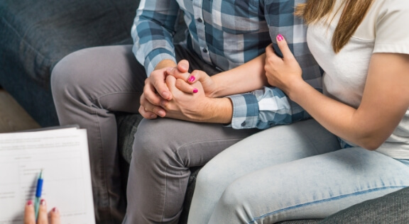 A couple holding each other.