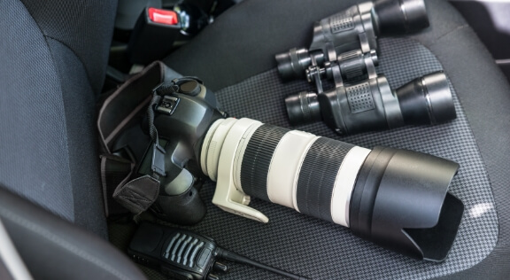 Some camera equipment in a car.