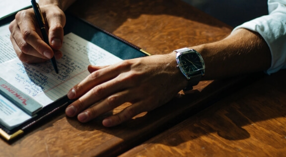 A man taking notes.